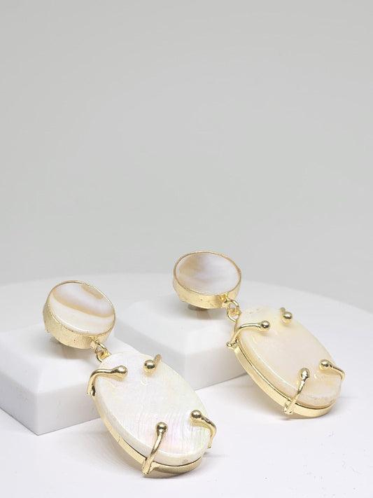 Handcrafted gold-plated dangle earrings with luminous Mother of Pearl stones, displayed on a white background